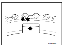 Check bearing for damage and uneven rotation. Replace if necessary.